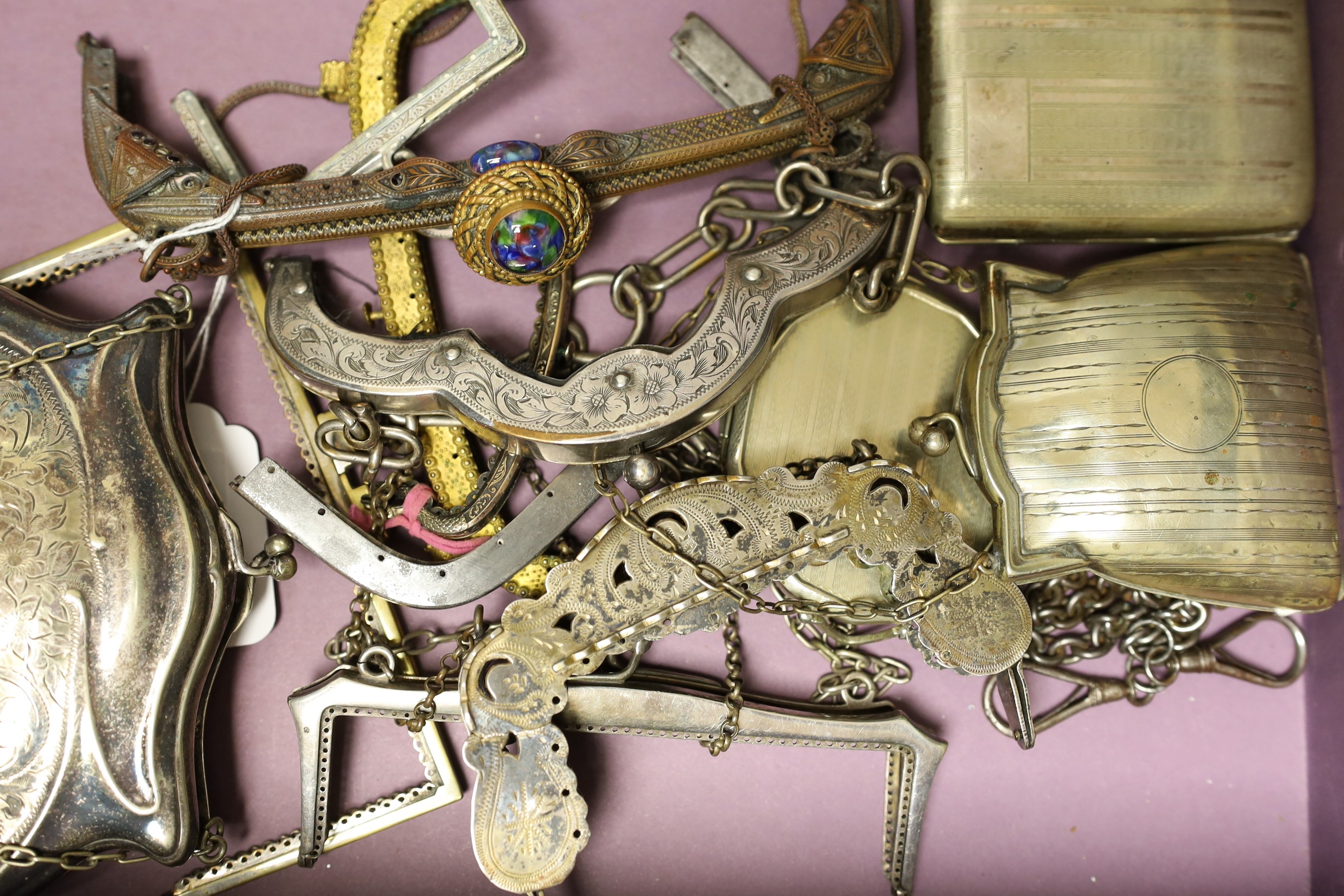 A collection of ten decorative 19th century and 20th century metal handbag frames, two Edwardian metal purses, a compact and cigarette case
